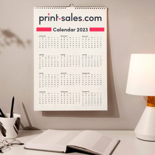An image showcasing a custom calendar printed by Print-Sales.com, featuring a vibrant and eye-catching design with sharp graphics and high-quality printing on durable paper stock.