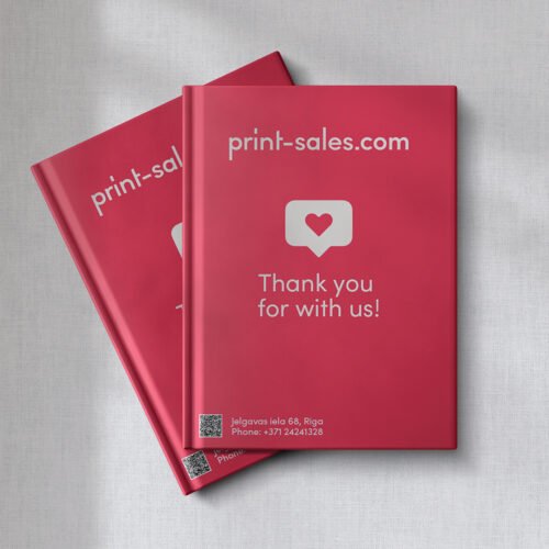 Books printed by print-sales.com showcasing a variety of designs and sizes.
